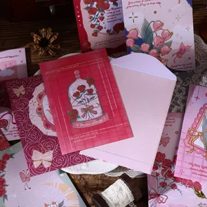Detailed view of vintage oil painting style floral envelopes and stationery set