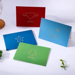 Detail of minimalist gold-foiled greeting cards in four vibrant colors with text.