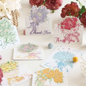 Dettaglio di varie cartoline di auguri a forma di bouquet con la scritta 'Thank You'