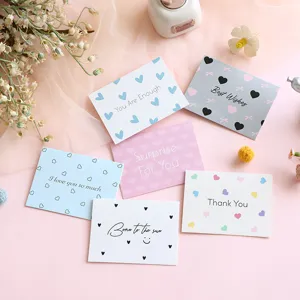 Variety of minimalist greeting cards with heart patterns and inspirational English text
