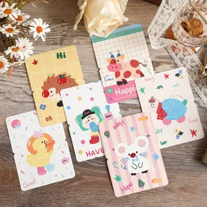 Close-up of colorful retro cartoon 3D greeting cards with animal designs on wood.