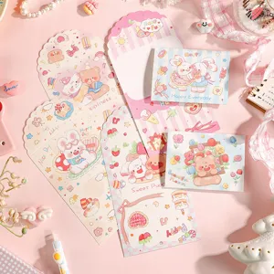 Detailed macro shot showing cute cartoon animal illustrations on various 3-fold gift cards