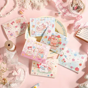 Close-up view of variety of cute cartoon 3-fold greeting cards with animal illustrations