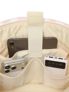 Vista interna del bolso multifuncional con amplios bolsillos organizadores para electrónica