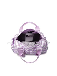 Macro view of purple checkered duffel bag interior showing large capacity for travel gear