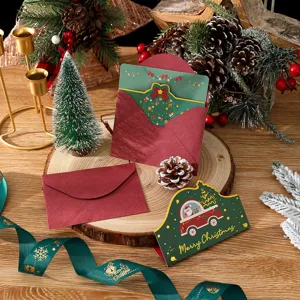 Detail view of festive Christmas card with gold car illustration and Merry Christmas text
