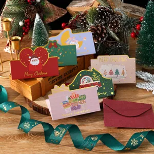 Detailed view of festive gold foil Christmas cards with cute illustrations and envelopes