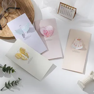 Selection of 3D folding greeting cards featuring heart, bow, and cake motifs