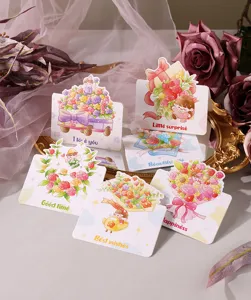 Close-up of cute cartoon floral greeting cards featuring vibrant colors and warm English wishes.
