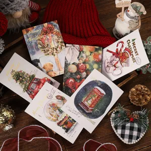 Detailed view of gold-stamped Christmas postcards with festive holiday illustrations