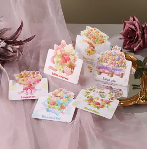 Close-up of various cartoon floral greeting cards with English blessings on pink gauze