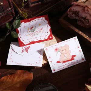 Detailed shot of retro greeting cards with charming bear and floral illustrations
