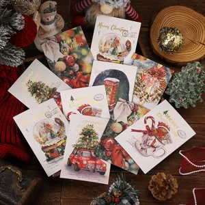 Detailed view of various Christmas greeting cards with gold hot stamping designs