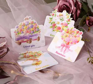 Detailed view of multiple cartoon flower greeting cards on pink gauze background