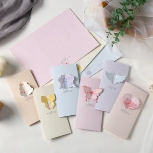 Set of elegant three-fold pop-up greeting cards with pastel butterfly and heart designs.