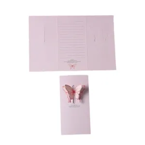 Elegant pink three-fold greeting card with a 3D pop-up butterfly and writing lines