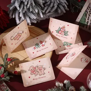 Detail view of vintage Christmas cards with cute cartoon illustrations and festive text