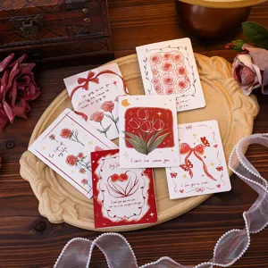Macro view of vintage floral greeting cards with elegant roses and tulip designs