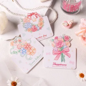 Vista de detalle de tarjetas de felicitación florales románticas con lazos y flores