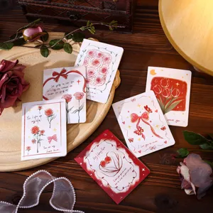 Assortment of vintage floral greeting cards featuring roses and tulips in a cozy setting