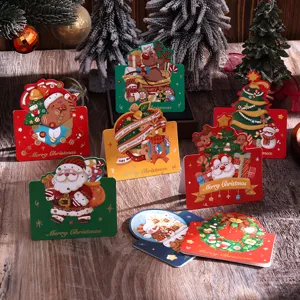 Dettaglio di biglietti di Natale vintage con stampa oro e motivi festivi di Babbo Natale