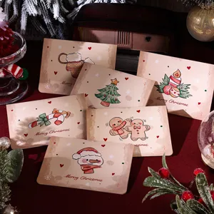 Detailed view of vintage Christmas cards featuring snowman, gingerbread, and tree motifs.