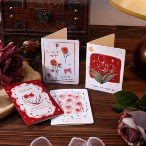 Macro view of vintage floral greeting cards with romantic rose and tulip designs.