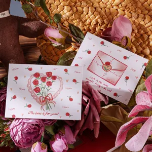 Detailed view of Valentine's Day greeting cards with romantic rose illustrations