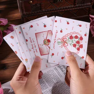 Close-up of large Valentine's Day floral greeting cards with romantic rose designs.