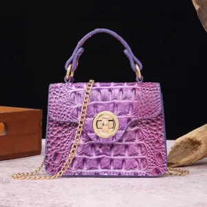 Detailed macro shot of vintage purple crocodile texture handbag with gold hardware