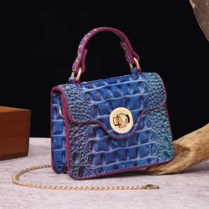 Detailed macro view of the blue gradient crocodile texture on a vintage retro handbag