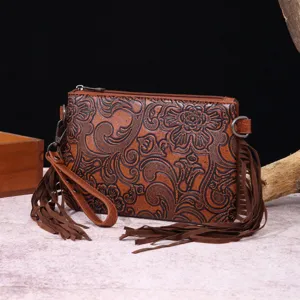 Bolso de mano estilo bohemio vintage con intrincado tallado de cuero floral y detalles de flecos