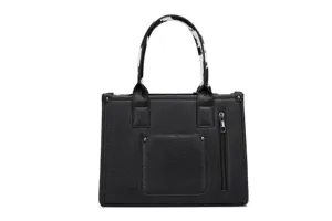 Bolso tote vintage de cuero sintético negro con asas de estampado de vaca y cremallera.
