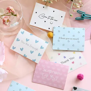 Detail showing various minimalist greeting cards with encouraging English messages.