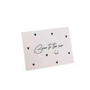 Minimalist white greeting card with heart pattern and script Born to the sun text