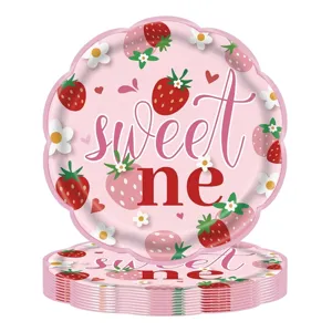 Detailed view of scalloped strawberry paper plates with 'sweet one' design for birthday party