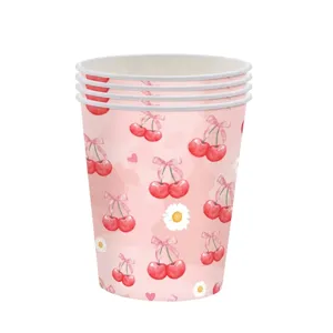 Detail of disposable paper cups featuring a vibrant pink cherry and daisy print