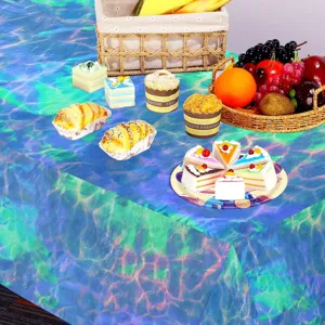 Detailed view of the vibrant blue ocean wave water ripple pattern on party cloth