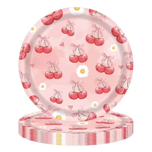 Detailed macro view of disposable party paper plates with cherry and daisy pattern