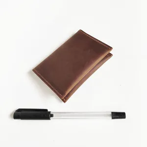 Detailed view of the retro crazy horse leather card holder with visible stitching