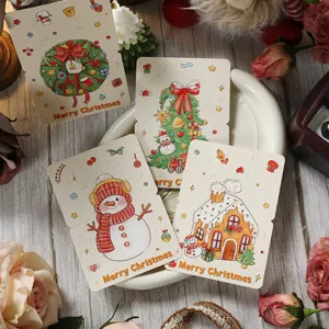Detailansicht von Retro-Weihnachtskarten mit Schneemann- und Kranz-Illustrationen