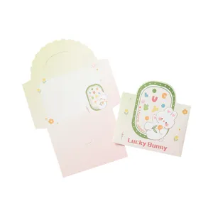 Ensemble d'enveloppes et de cartes de vœux mignonnes sur le thème du lapin rose et vert