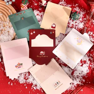 Assorted die-cut Christmas greeting cards with festive gold foil designs on red background