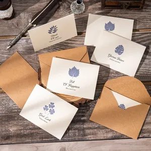 Vintage kraft paper greeting cards with envelopes for graduation and gift messages.