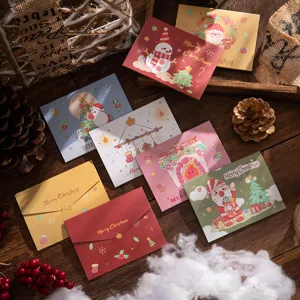Festive Christmas tri-fold greeting cards featuring Santa and snowman illustrations.