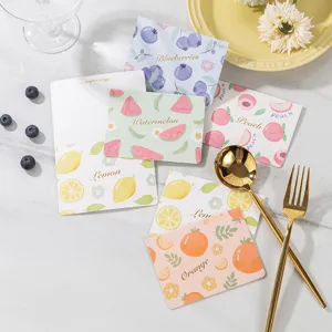 Cute fruit greeting cards with gold foil patterns displayed on a marble background.
