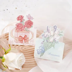 Detail of hand-painted floral greeting cards with rose and tulip illustrations