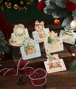 Detailed view of assorted Christmas cards with gold stamping and festive illustrations