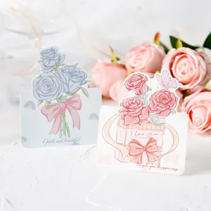 Close-up detail of hand-drawn rose greeting cards featuring warm English message prints.