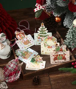 Detailed view of festive gold-stamped Christmas greeting cards in a cozy holiday setting.